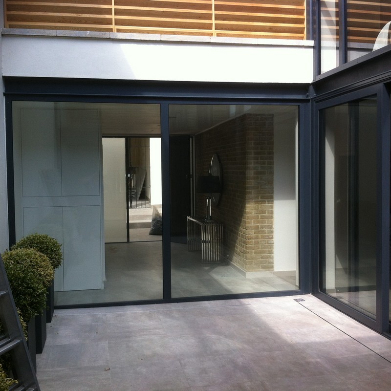 Floor-to-ceiling sliding doors opening to courtyard in Tulse Hill