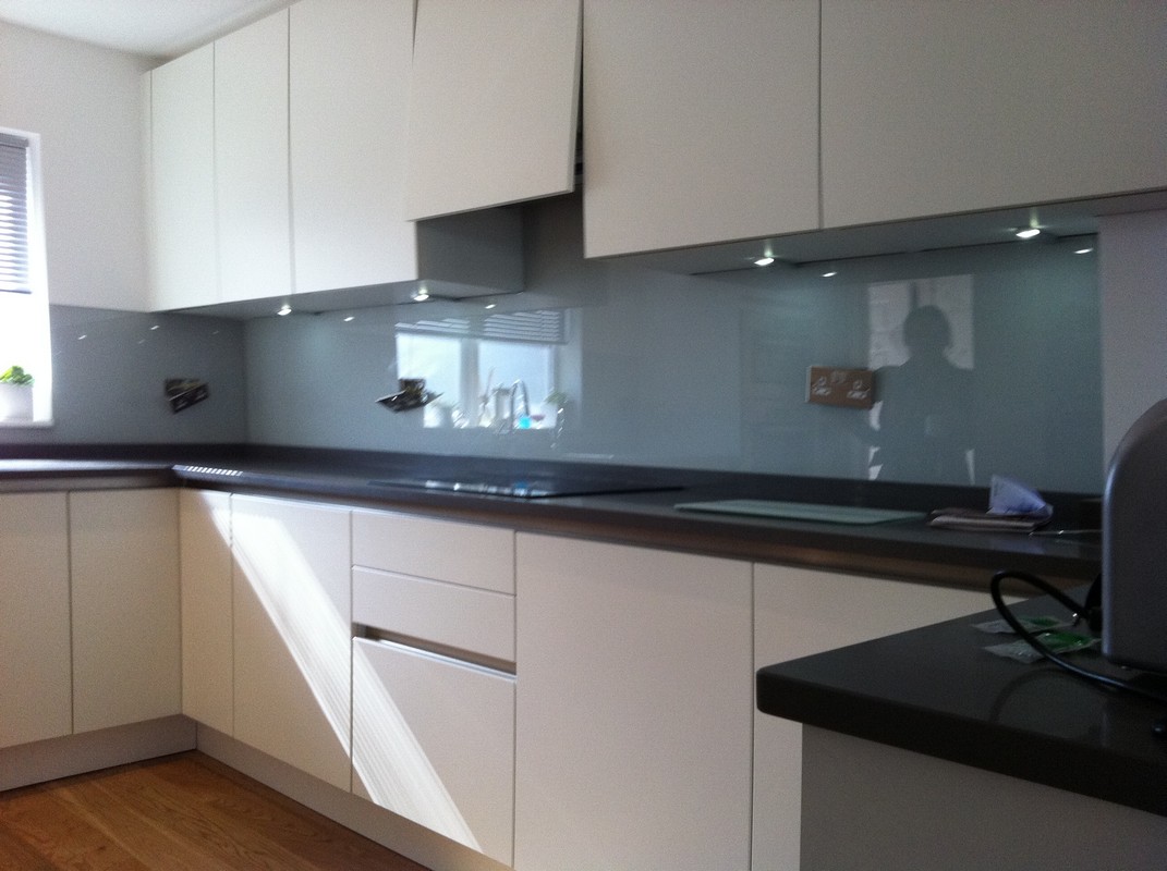 Grey glass kitchen splashback with LED lighting in Tulse Hill